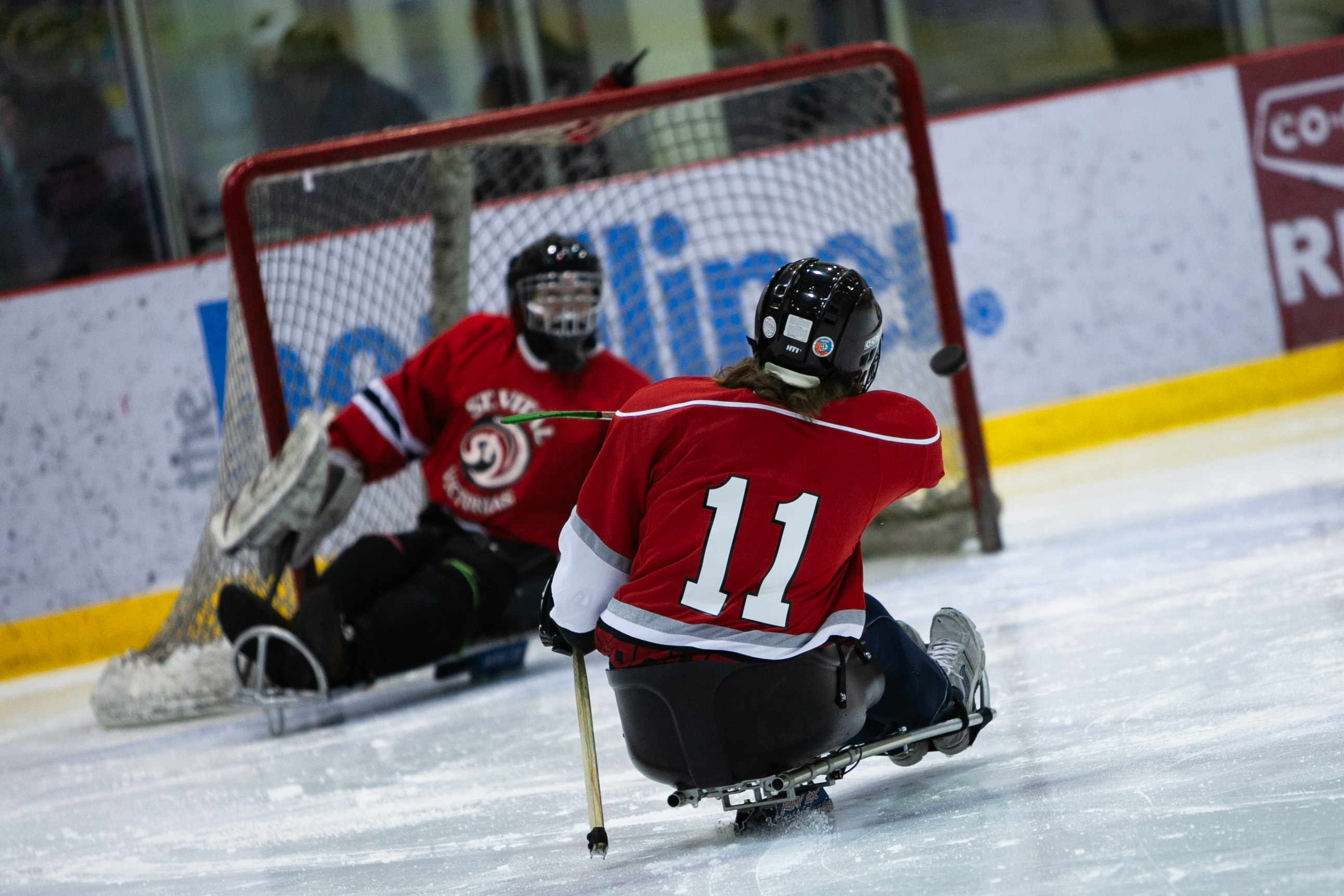 Hockey goalie making a glove save